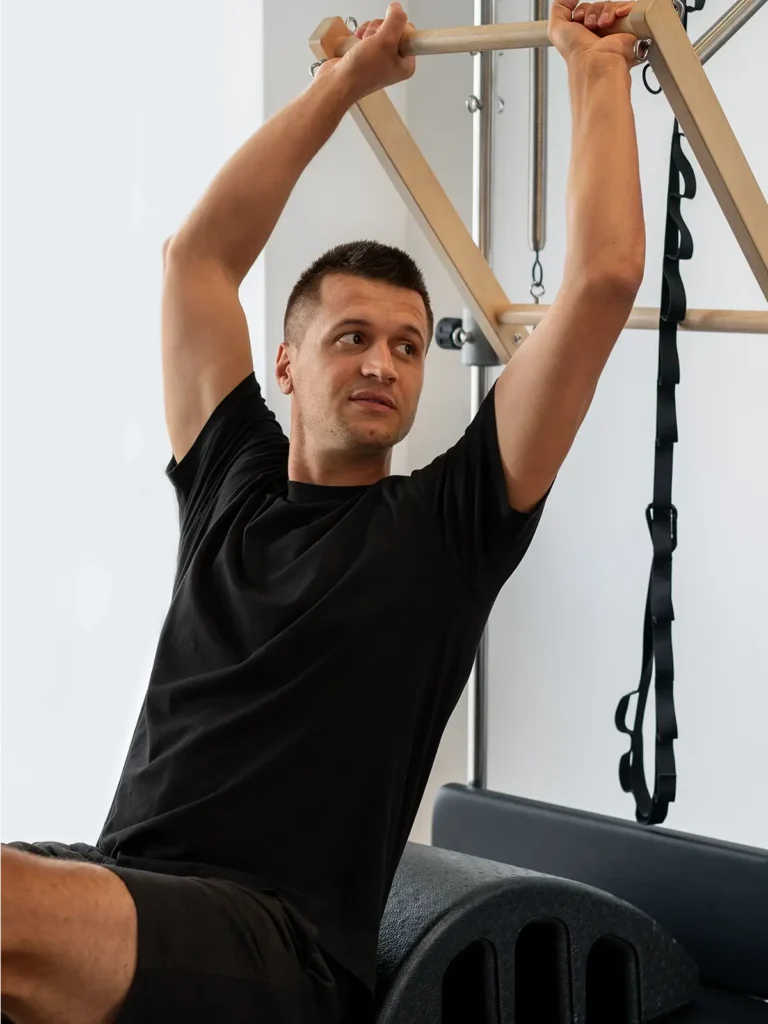 Pilates man on machine
